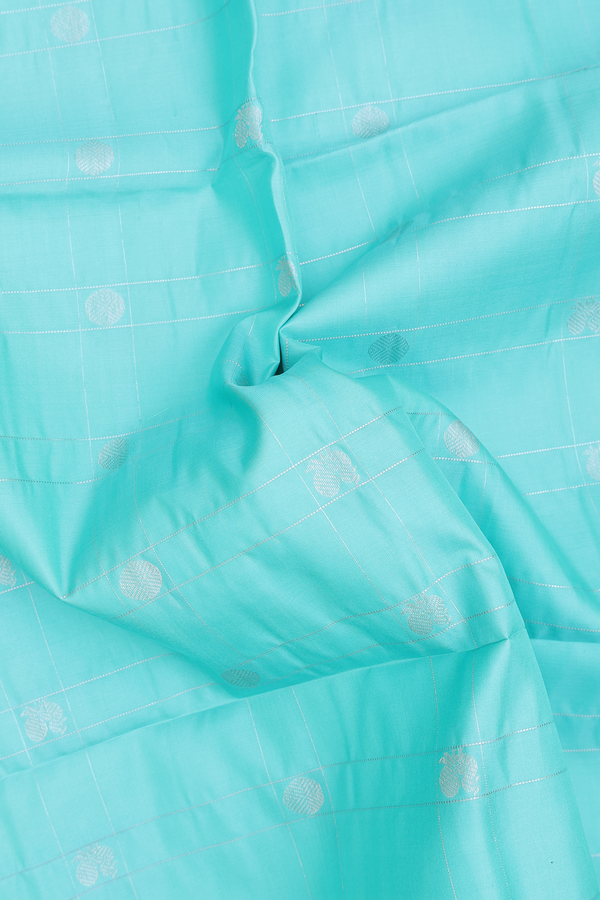 Soft Silk Saree In Tiffany Blue Along Checks With Buttas