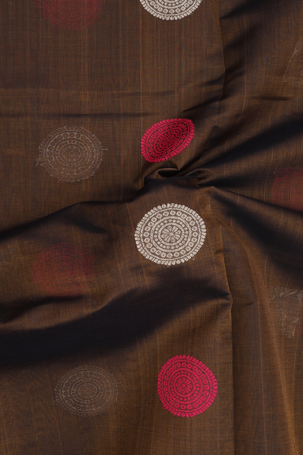 Silk Cotton Saree In Greenish Brown With Peacock Buttas