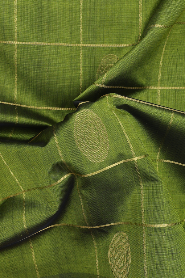 Silk Cotton Saree In Green Along Checks With Buttas