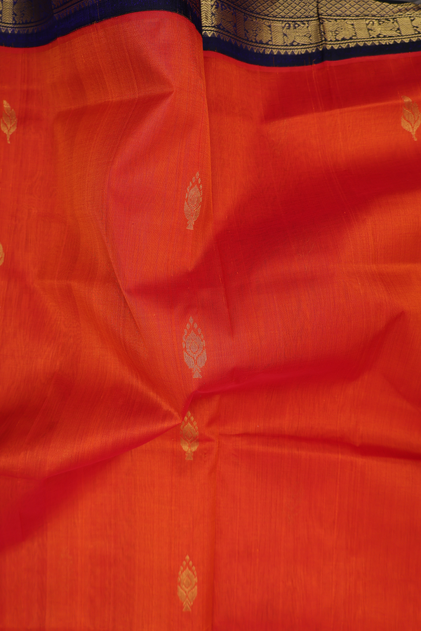 Silk Cotton Saree In Reddish Orange With Leaf Buttas