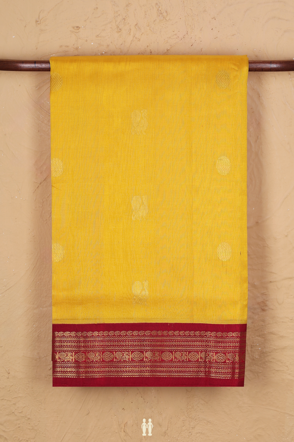 Silk Cotton Saree In Yellow With Peacock Buttas