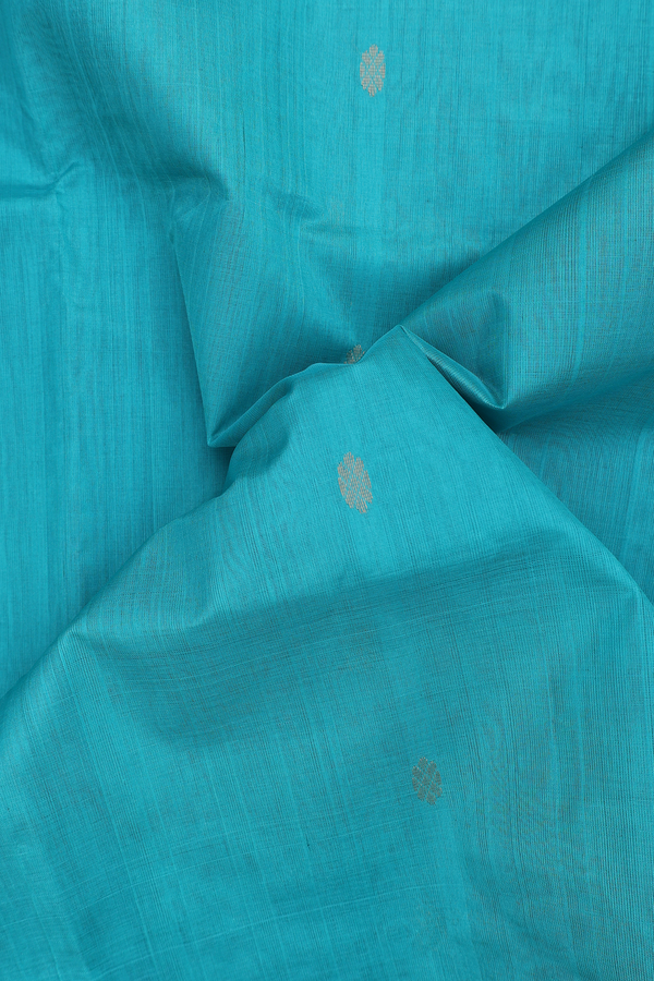 Silk Cotton Saree In Green With Zari Buttas