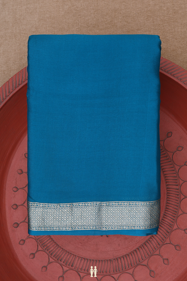 Chiffon Saree In Plain Peacock Blue With Zari Border