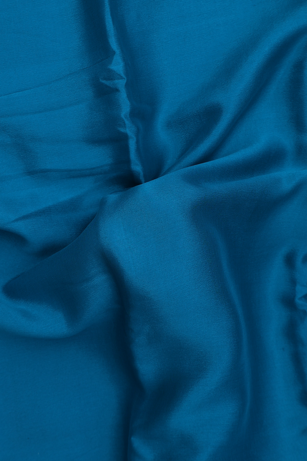 Chiffon Saree In Plain Peacock Blue With Zari Border