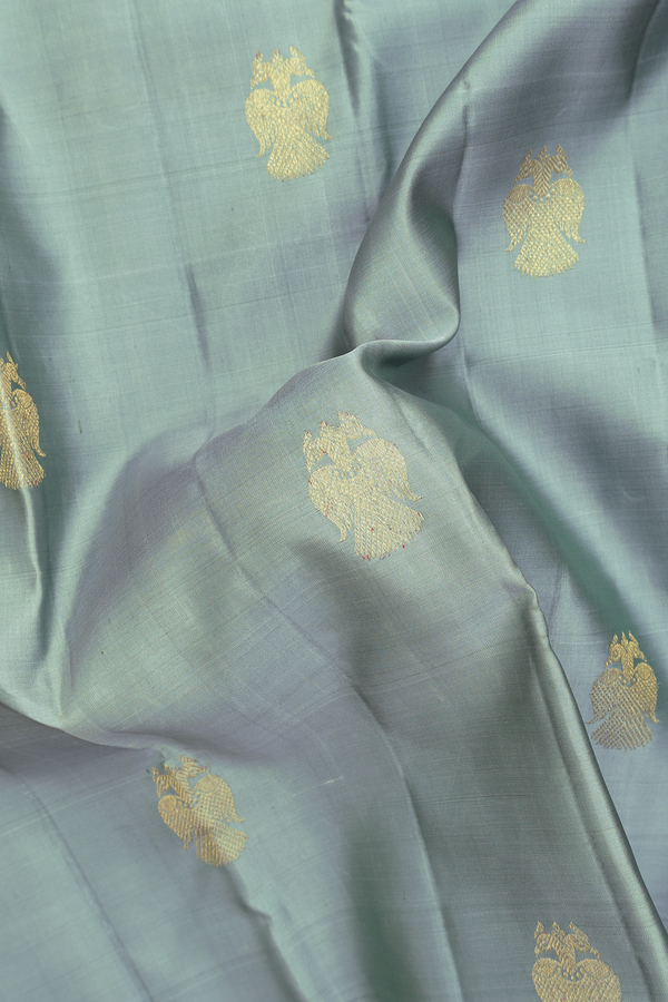 Kanchipuram Silk In Greenish Grey With Iruthalai Pakshi Buttas