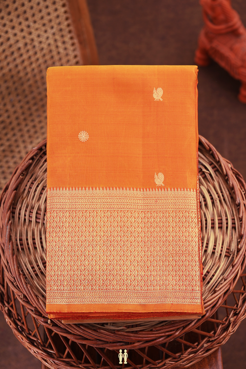 Kanchipuram Silk Saree In Orange With Peacock Buttas