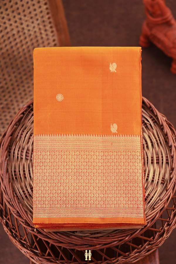 Kanchipuram Silk Saree In Orange With Peacock Buttas
