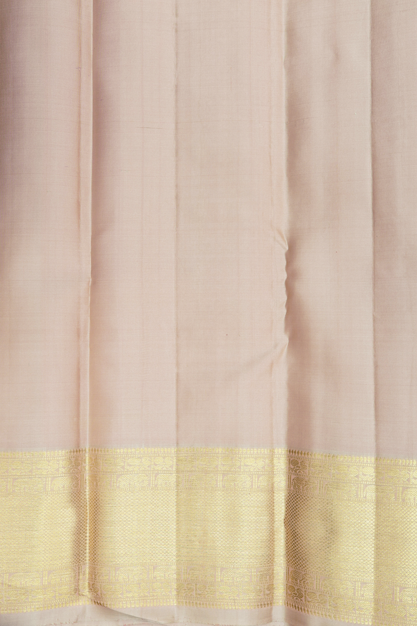 Kanchipuram Silk Saree In Cream Color With Peacock Buttas