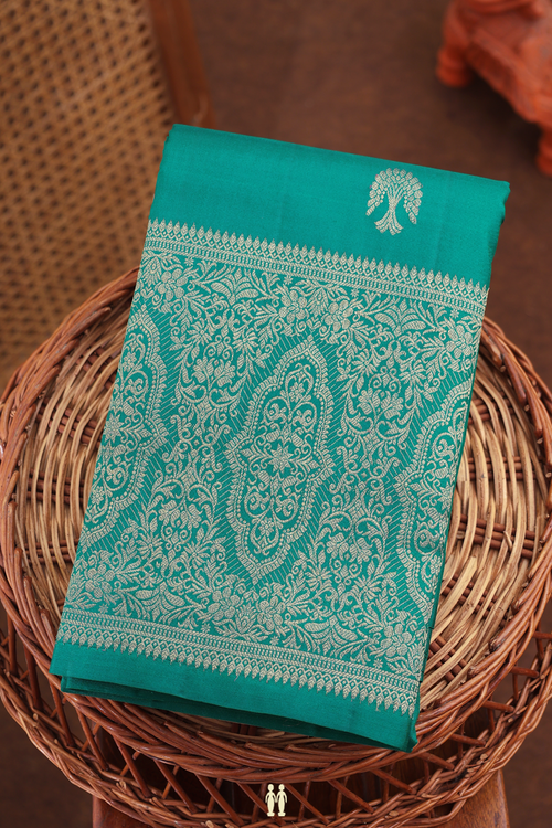 Kanchipuram Silk Saree In Peacock Green With Zari Buttas