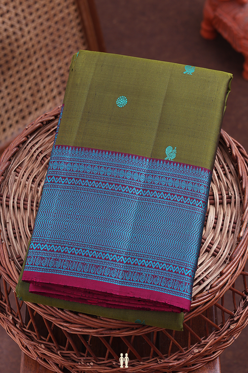 Kanchipuram Silk Saree In Olive Green With Peacock Buttas