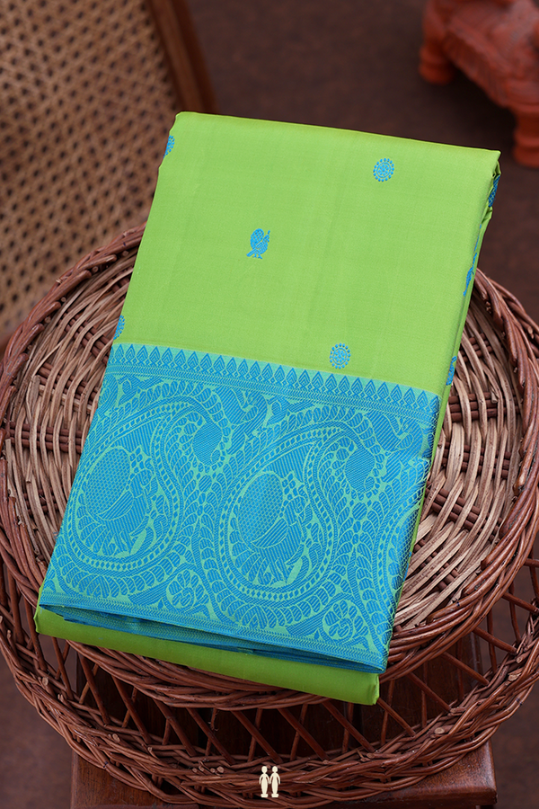 Kanchipuram Silk Saree In Parrot Green With Peacock Buttas