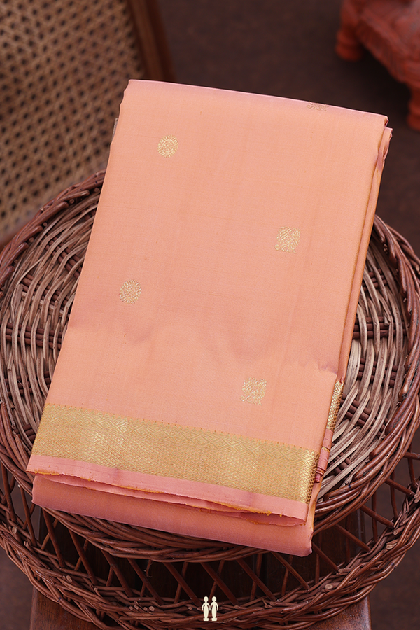 Kanchipuram Silk Saree In Light Orange With Peacock Buttas