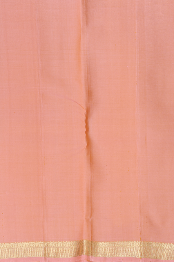 Kanchipuram Silk Saree In Light Orange With Peacock Buttas