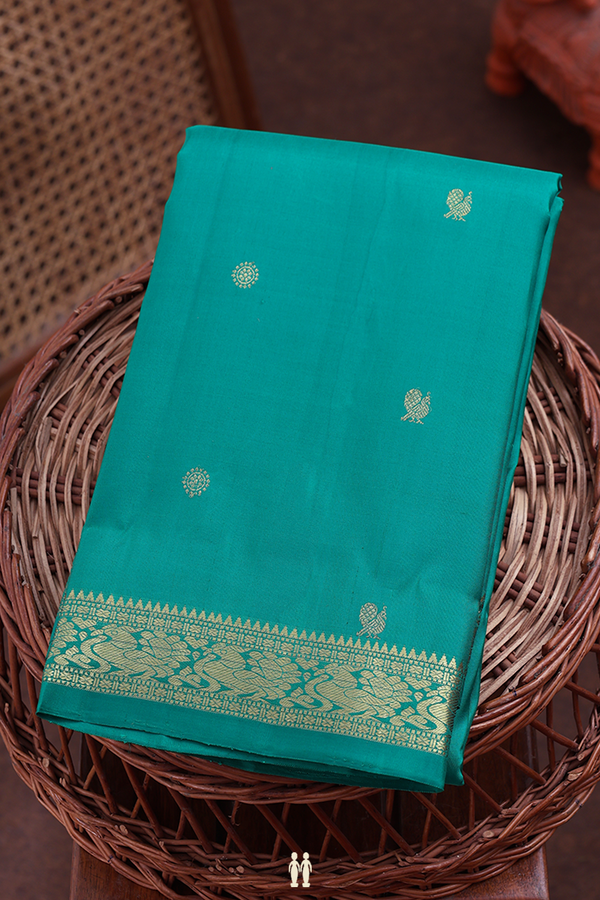 Kanchipuram Silk Saree In Green With Peacock Buttas