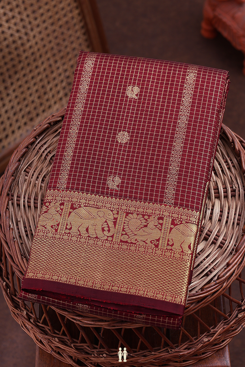 Kanchipuram Silk Saree In Maroon Along Checks With Buttas