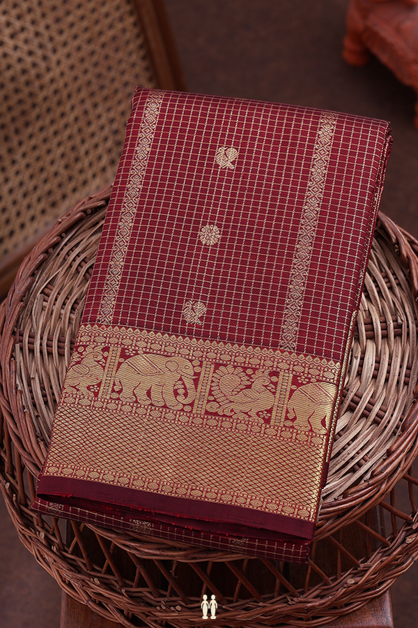 Kanchipuram Silk Saree In Maroon Along Checks With Buttas