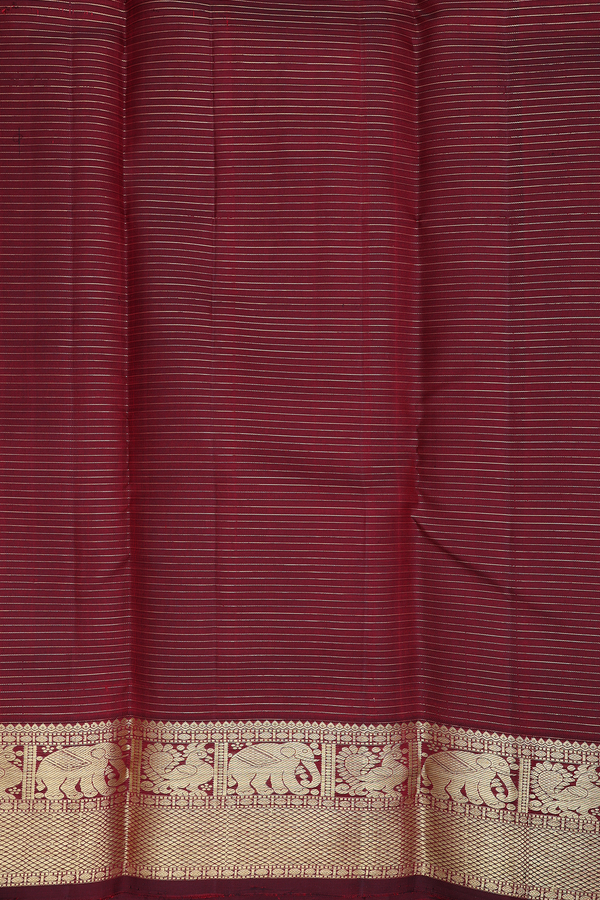 Kanchipuram Silk Saree In Maroon Along Checks With Buttas