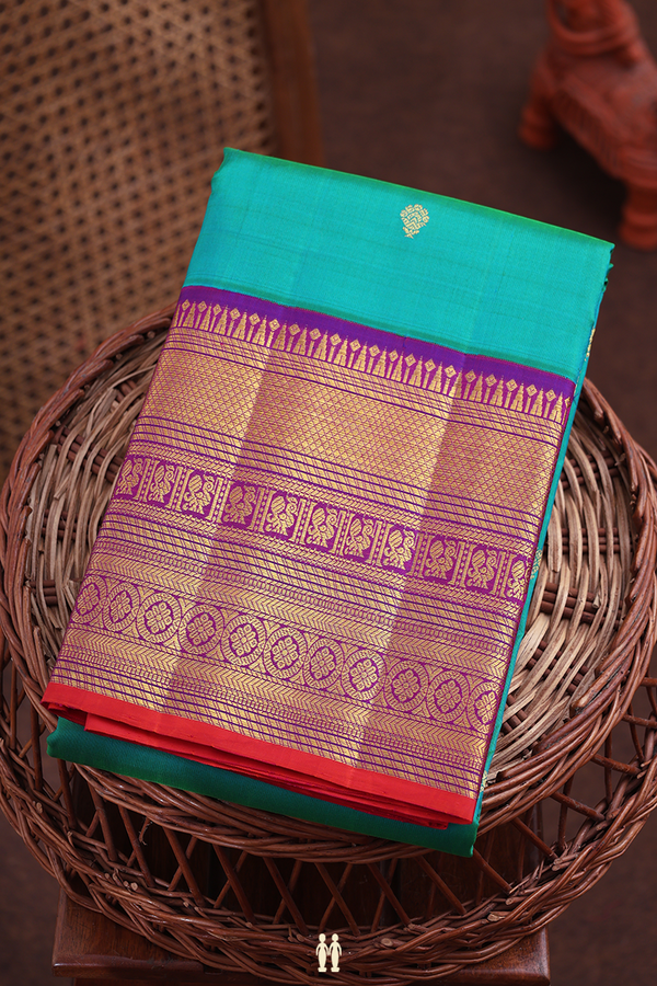 Kanchipuram Silk Saree In Bluish Green With Floral Buttas