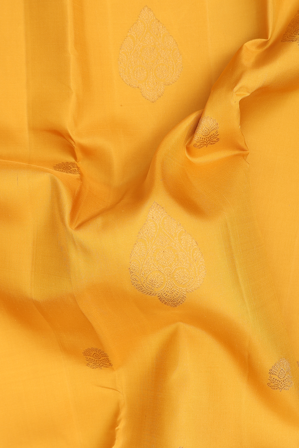 Kanchipuram Silk Saree In Saffron Yellow With Zari Motifs