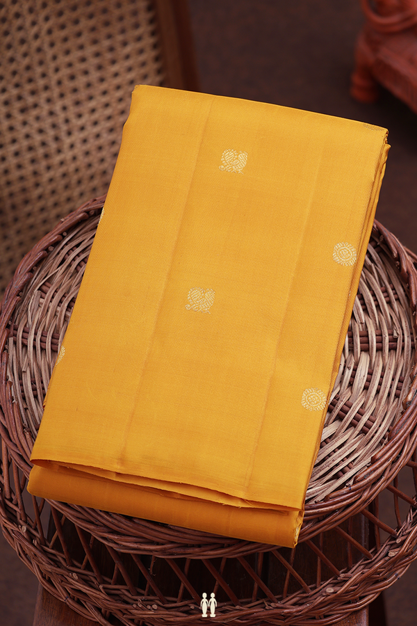 Kanchipuram Silk Saree In Saffron Yellow With Peacock Buttas