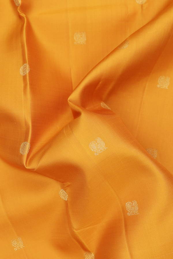 Kanchipuram Silk Saree In Saffron Yellow With Peacock Buttas
