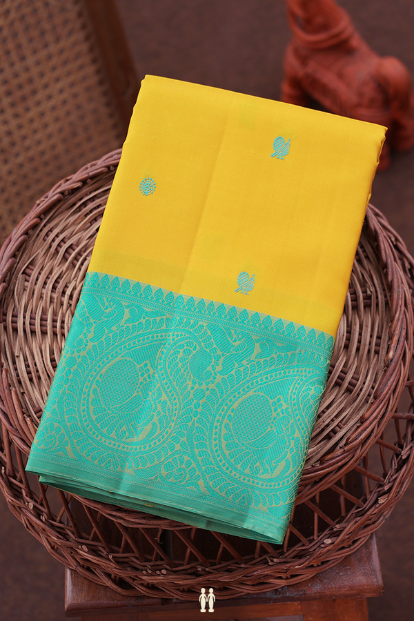 Kanchipuram Silk Saree In Saffron Yellow With Chakram Buttas