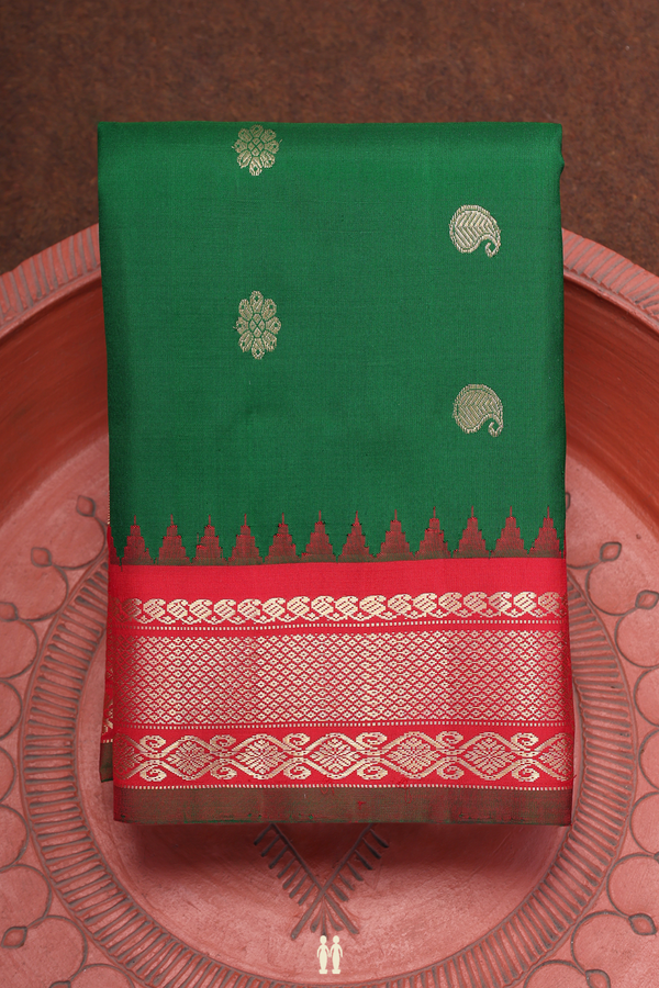 Gadwal Silk Saree In Emerald Green With Floral Buttas