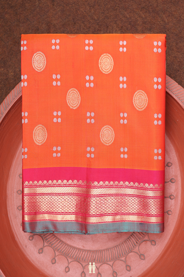Gadwal Silk Saree In Orange With Chakram Buttas
