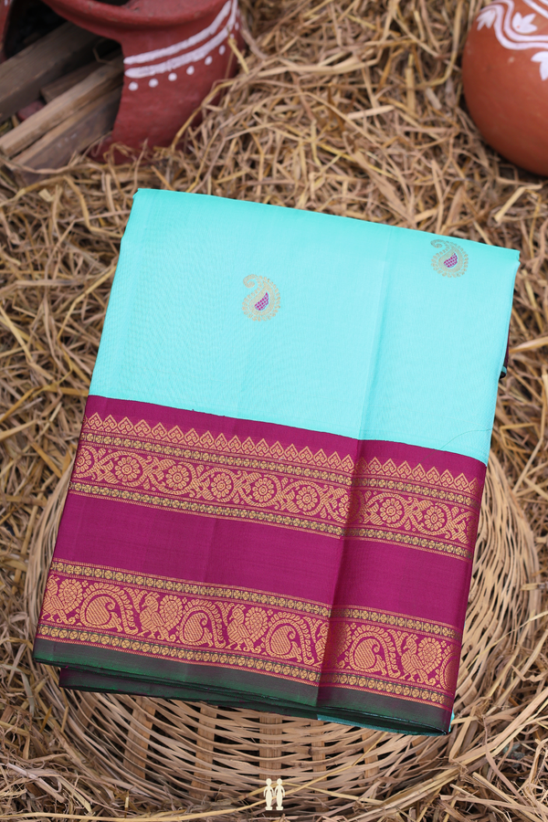 Gadwal Silk Saree In Turquoise Blue With Paisley Buttas