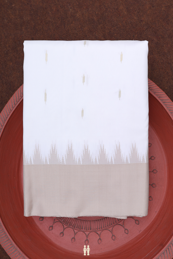 Gadwal Silk Saree In White With Zari Buttas