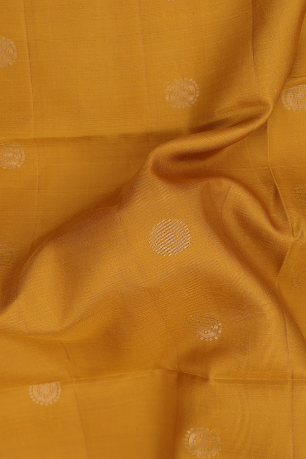 Soft Silk Saree In Yellow With Chakram Buttas