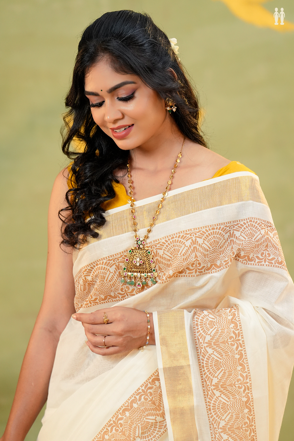 Iruthalai Pakshi Border White Onam Collection