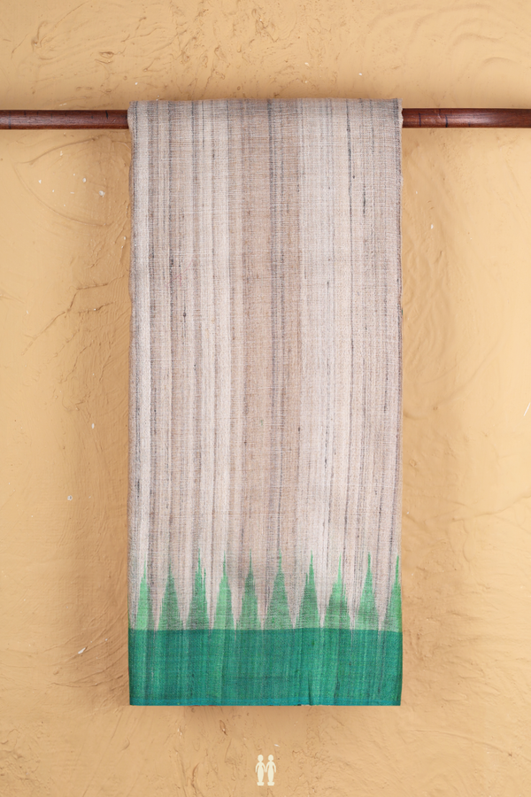 Jute Saree In Plain Pastel Brown With Ganga Jamuna Border