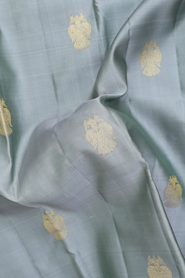 Kanchipuram Silk In Greenish Grey With Iruthalai Pakshi Buttas