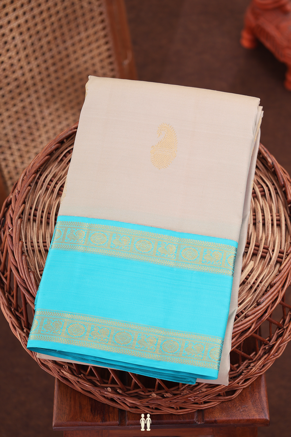 Kanchipuram Silk Saree In Cream With Paisley Buttas