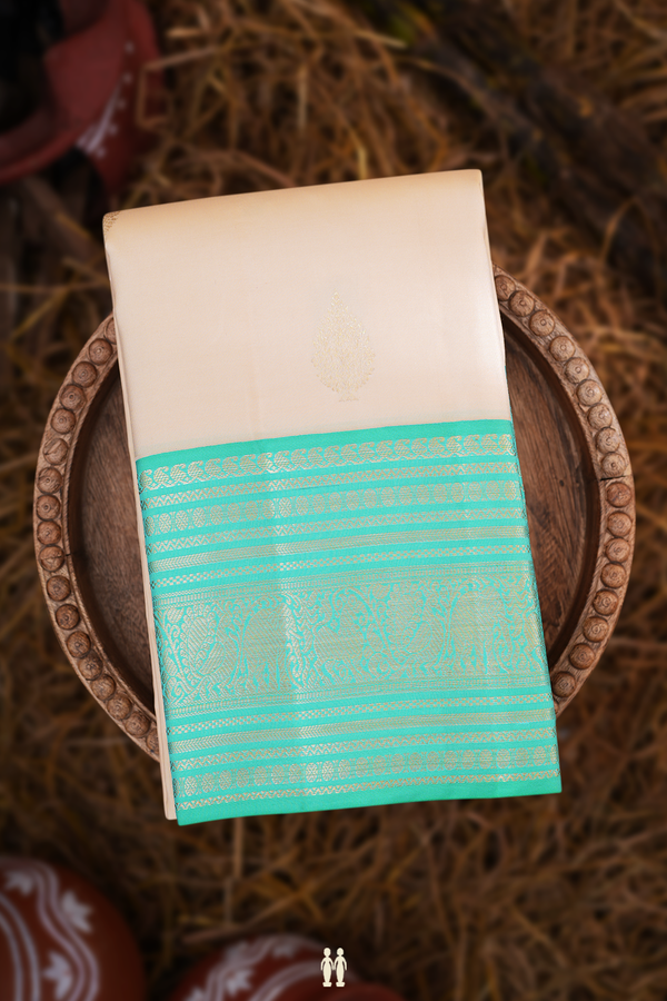 Kanchipuram Silk Saree In Beige With Thilagam Buttas