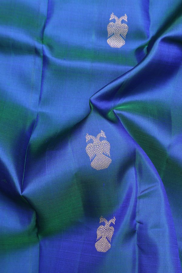 Kanchipuram Silk Saree In Blue With Iruthalai Pakshi Buttas