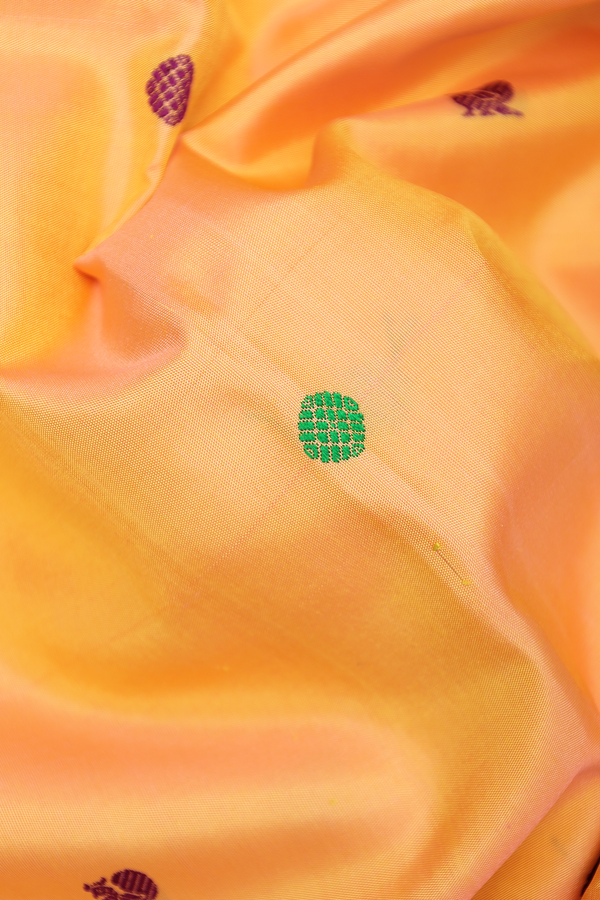 Kanchipuram Silk Saree In Blush Orange With Peacock Buttas