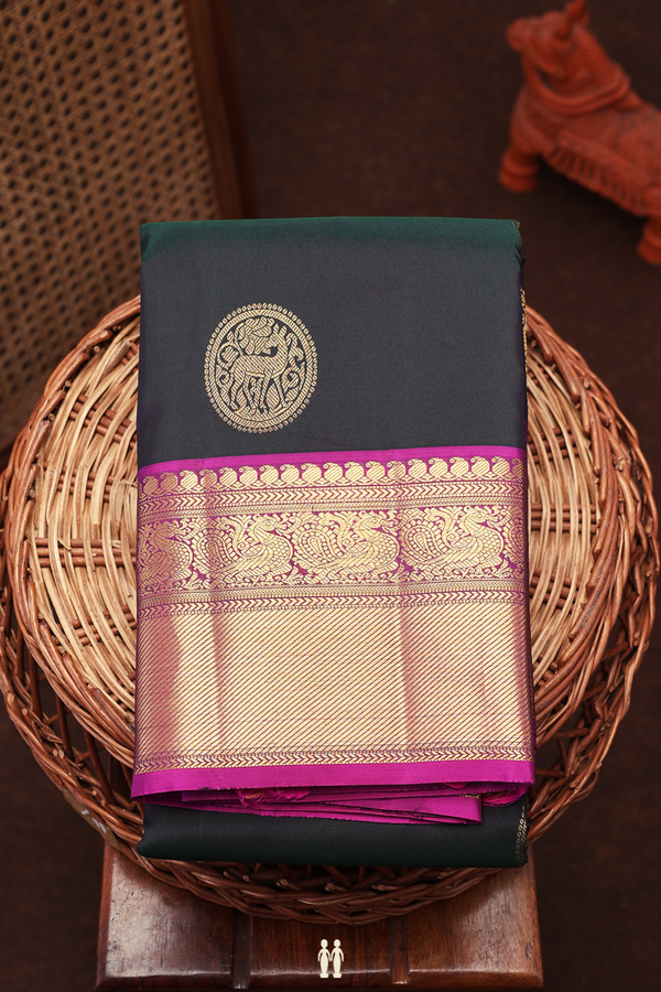 Kanchipuram Silk Saree In Bottle Green With Chakram Buttas