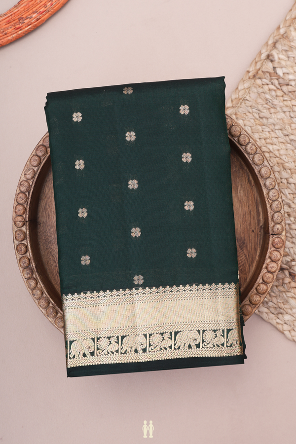 Kanchipuram Silk Saree In Bottle Green With Floral Buttas