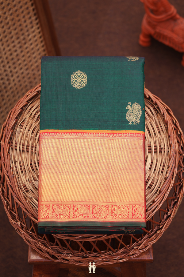 Kanchipuram Silk Saree In Bottle Green With Peacock Buttas
