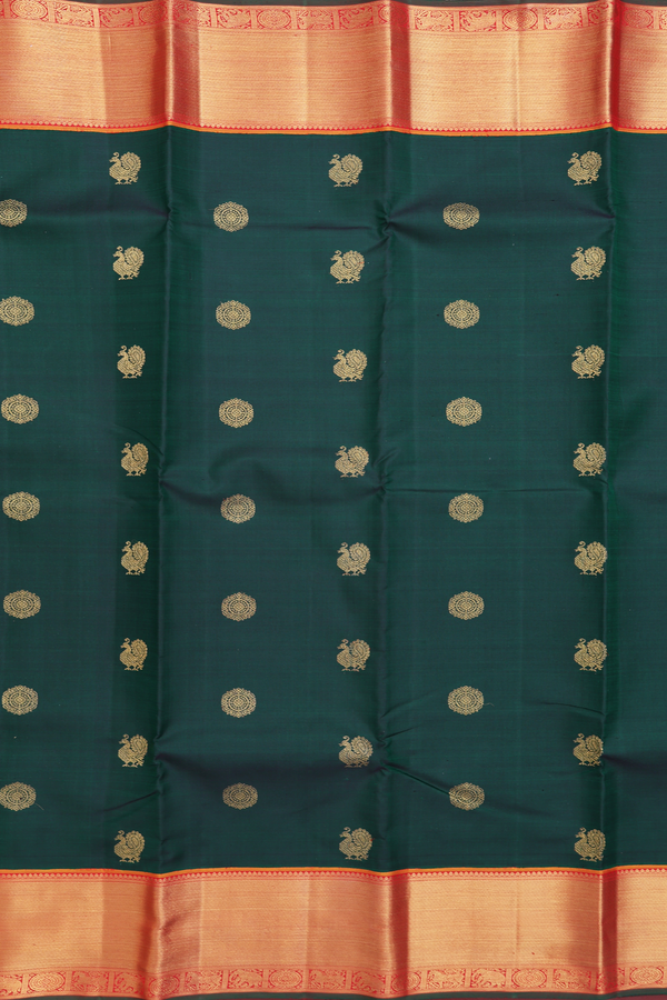 Kanchipuram Silk Saree In Bottle Green With Peacock Buttas