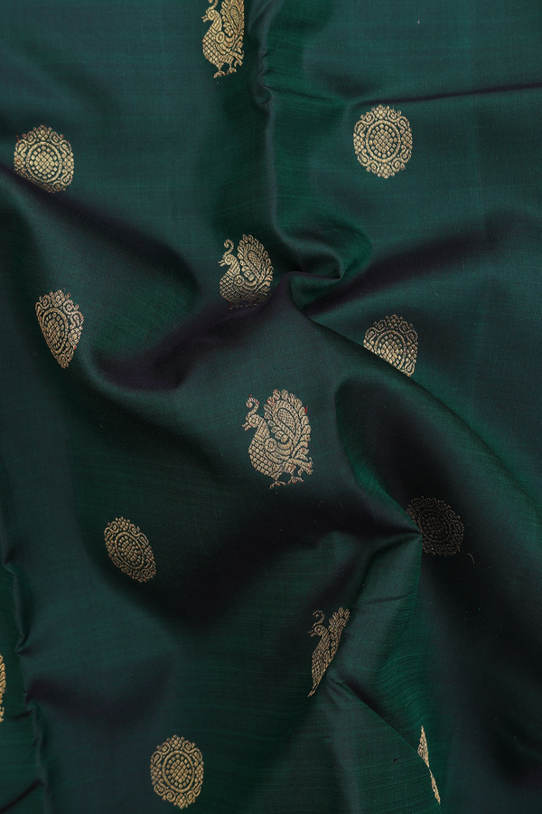 Kanchipuram Silk Saree In Bottle Green With Peacock Buttas