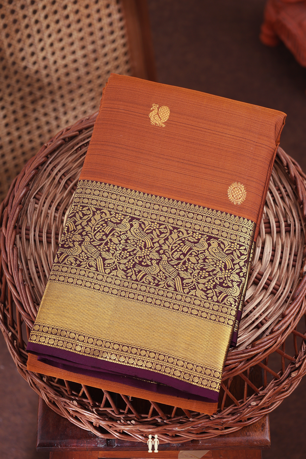 Kanchipuram Silk Saree In Brown With Peacock Buttas