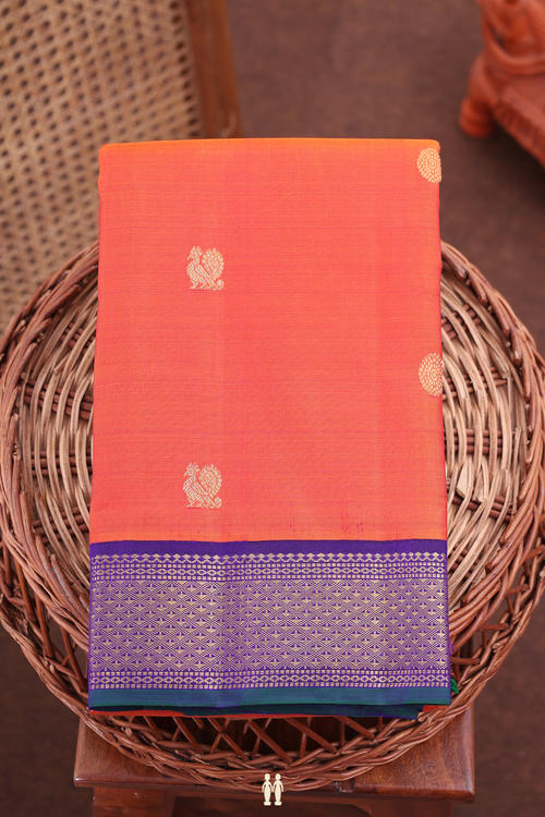 Kanchipuram Silk Saree In Burnt Orange With Peacock Buttas