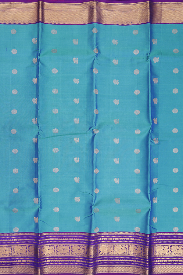 Kanchipuram Silk Saree In Cerulean Blue With Peacock Buttas