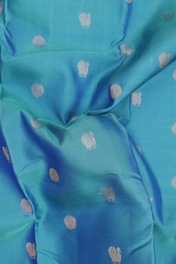 Kanchipuram Silk Saree In Cerulean Blue With Peacock Buttas