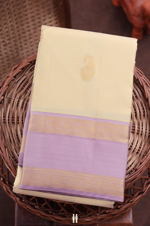 Kanchipuram Silk Saree In Cream Color With Paisley Buttas