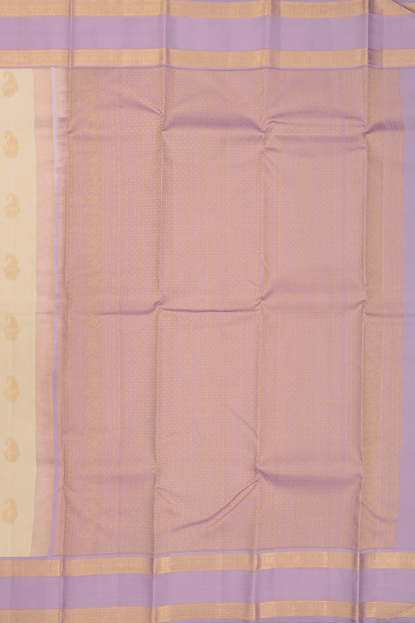 Kanchipuram Silk Saree In Cream Color With Paisley Buttas
