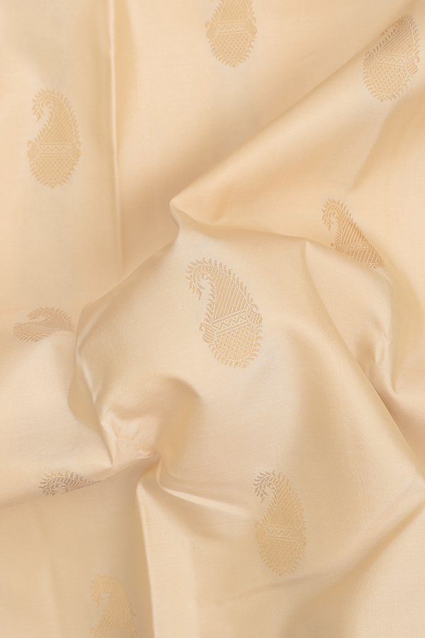 Kanchipuram Silk Saree In Cream Color With Paisley Buttas